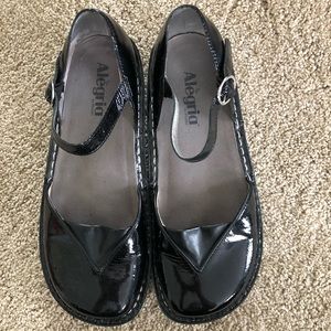 Black Alegria ankle buckled shoes.